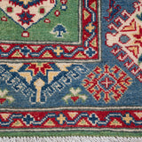 Border and edge detail of green & red Kazak-inspired wool rug 29347.