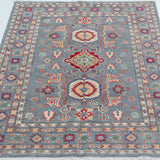 Full view from a low angle of blue & ivory Kazak-inspired wool rug 29645.