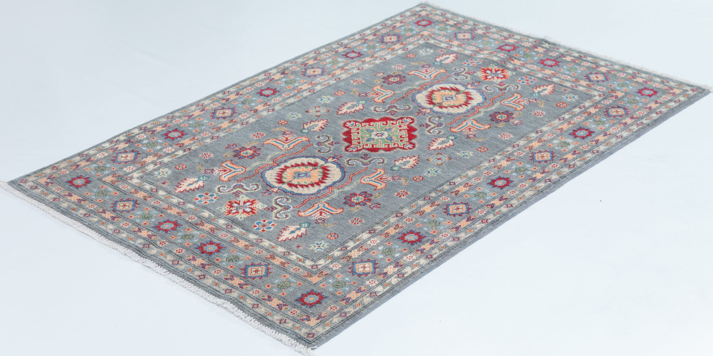 Full view at an angle of blue & ivory Kazak-inspired wool rug 29645.