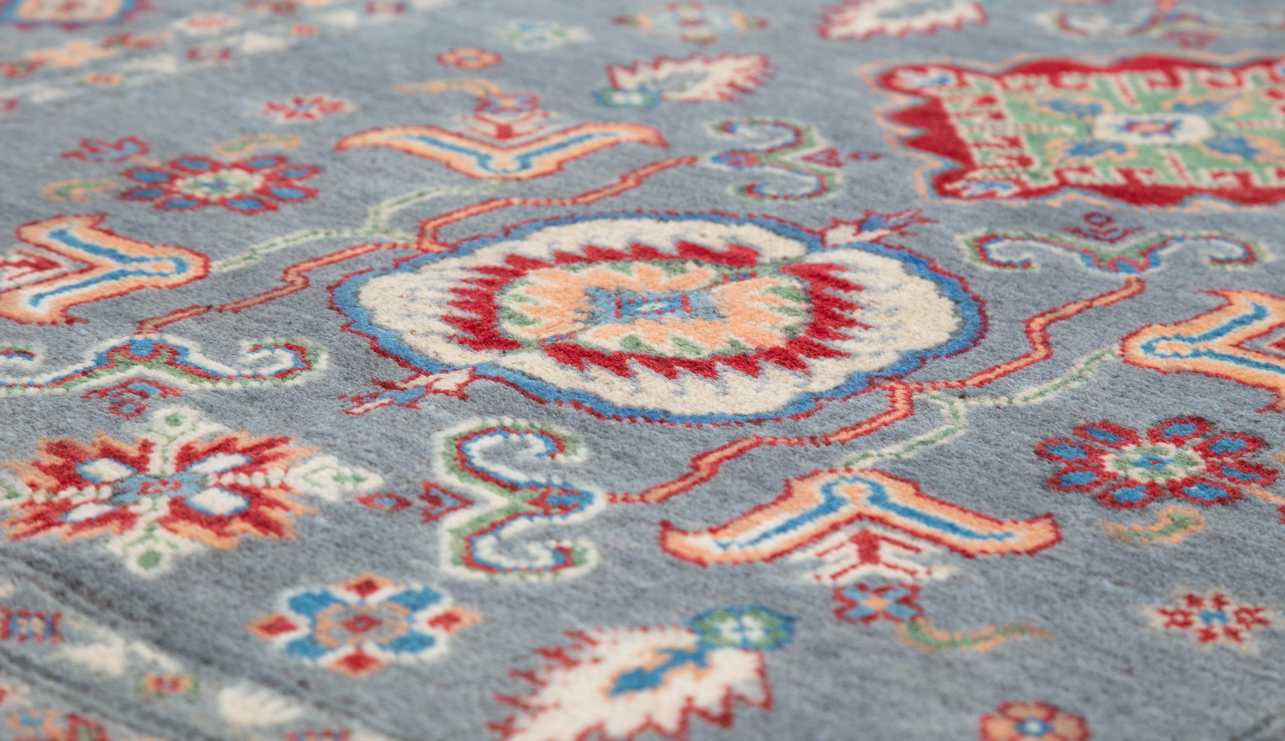 Pattern detail of blue & ivory Kazak-inspired wool rug 29645.