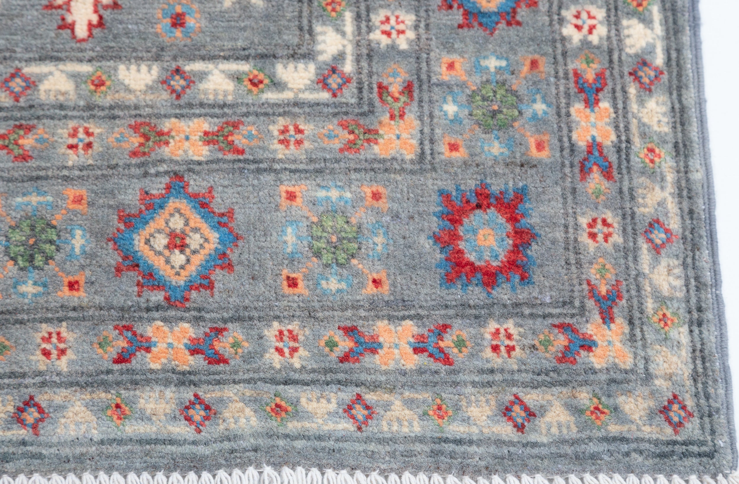 Border and edge detail of blue & ivory Kazak-inspired wool rug 29645.