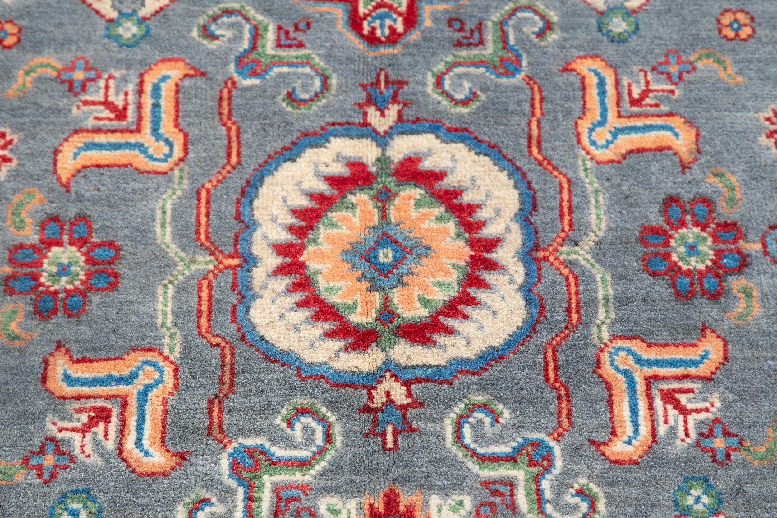Pattern detail of blue & ivory Kazak-inspired wool rug 29645.