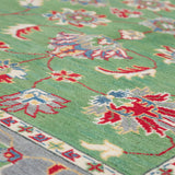 Pattern detail of green & ivory Kazak-inspired wool rug 29646.