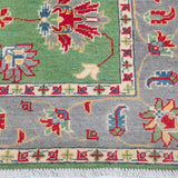 Border and edge detail of green & ivory Kazak-inspired wool rug 29646.