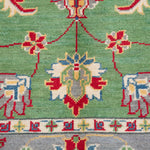 Pattern detail of green & ivory Kazak-inspired wool rug 29646.
