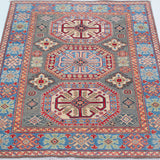 Full view from a low angle of blue & ivory Kazak-inspired wool rug 29647.