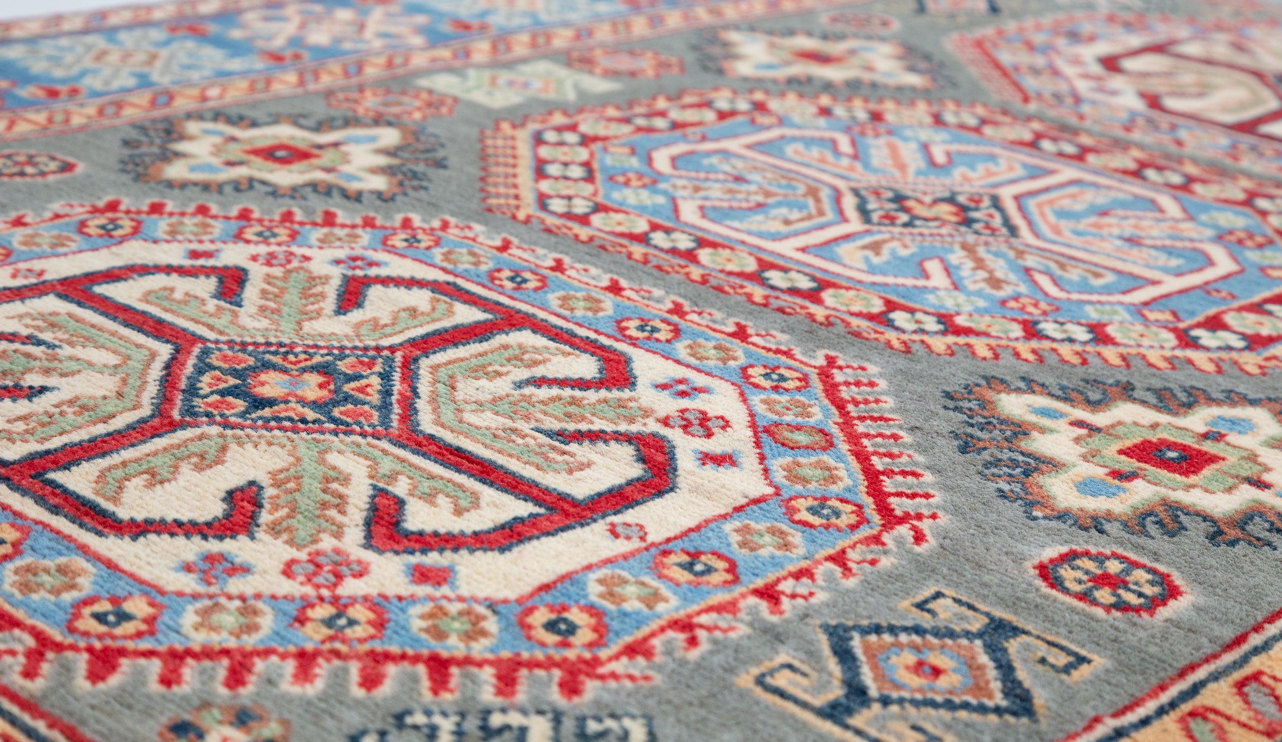 Pattern detail of blue & ivory Kazak-inspired wool rug 29647.