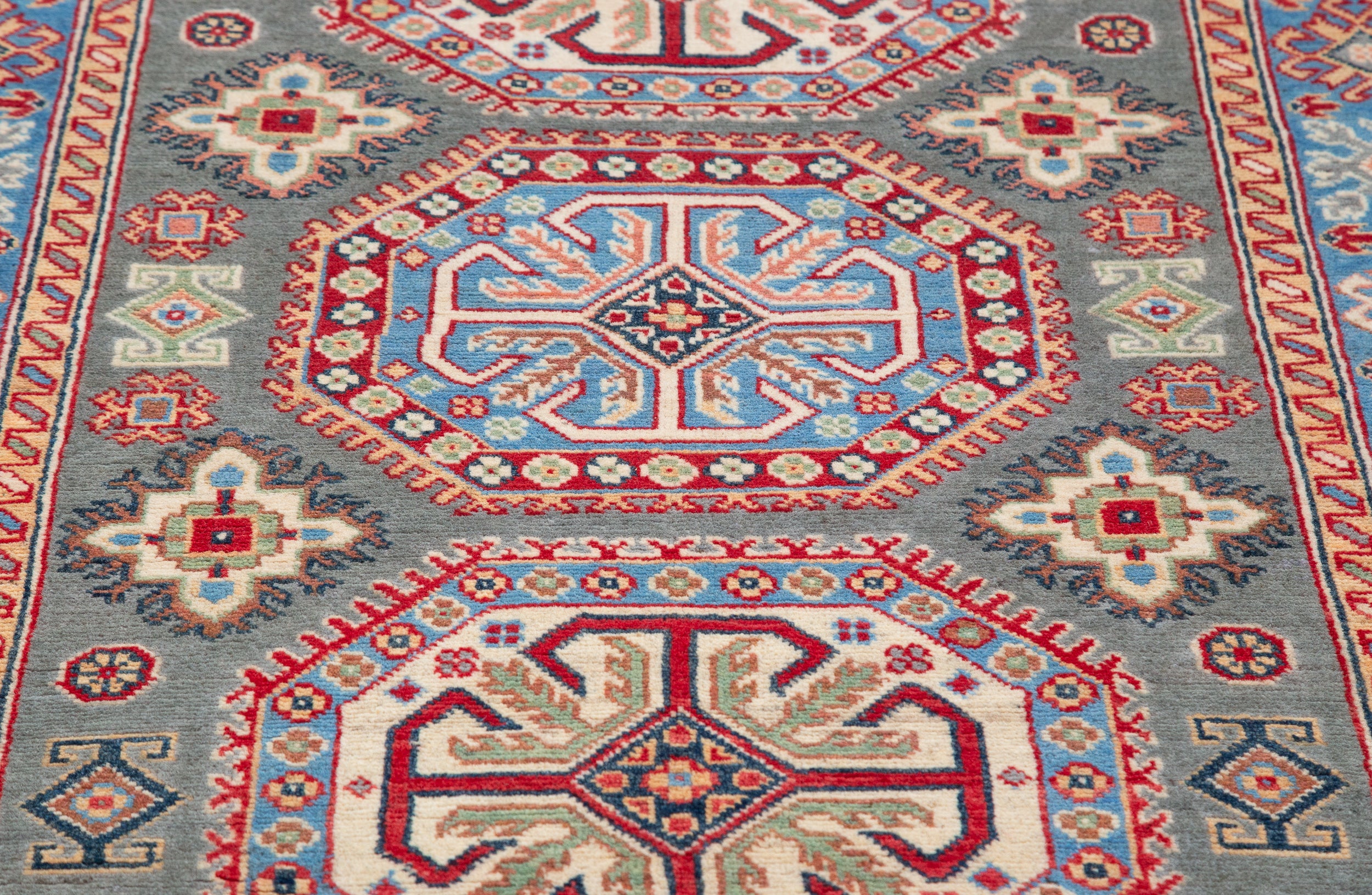 Pattern detail of blue & ivory Kazak-inspired wool rug 29647.
