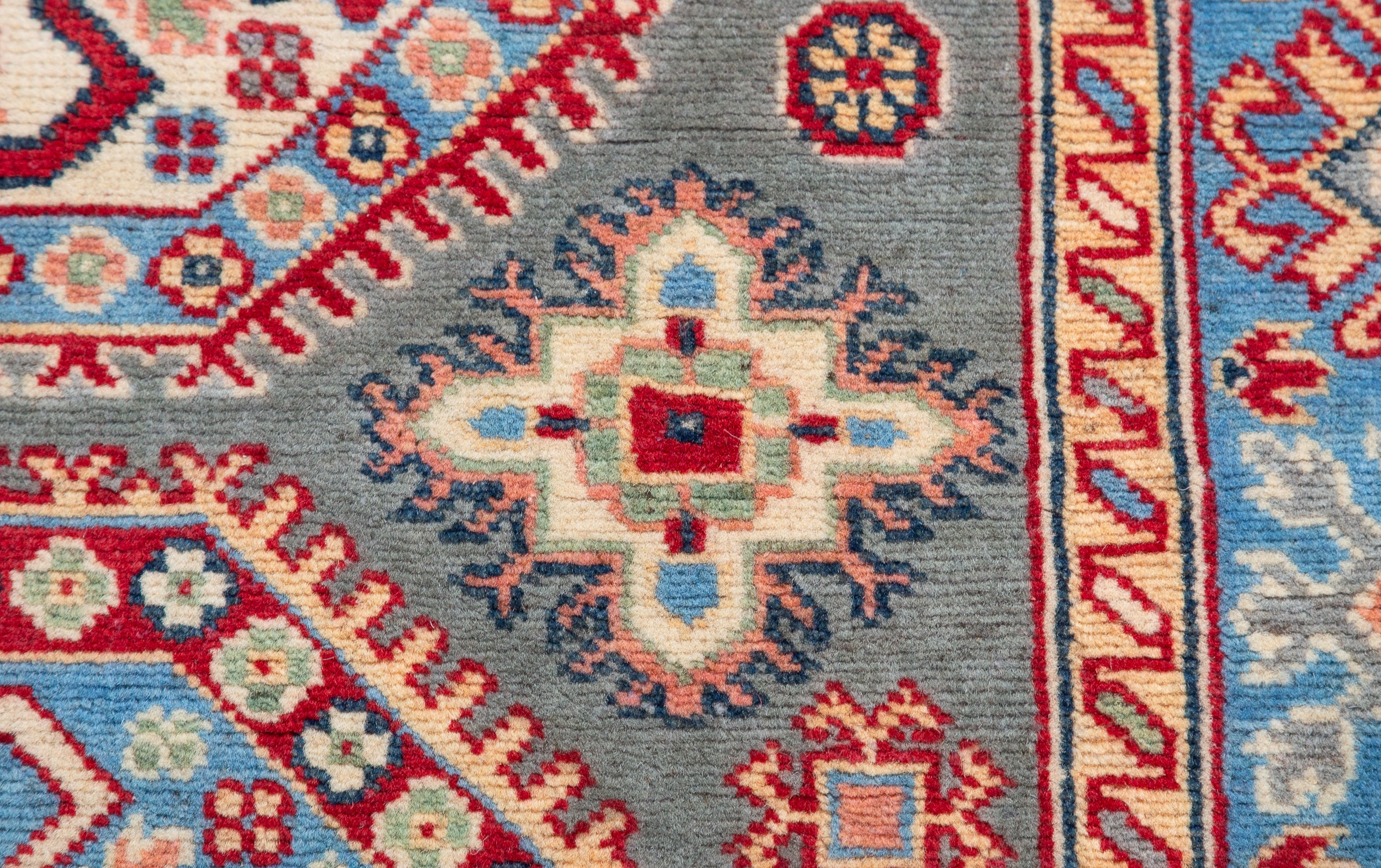 Pattern detail of blue & ivory Kazak-inspired wool rug 29647.