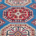 Pattern detail of blue & red Kazak-inspired wool rug 29648.