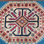Pattern detail of blue & red Kazak-inspired wool rug 29648.