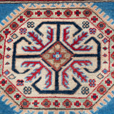 Pattern detail of blue & red Kazak-inspired wool rug 29648.