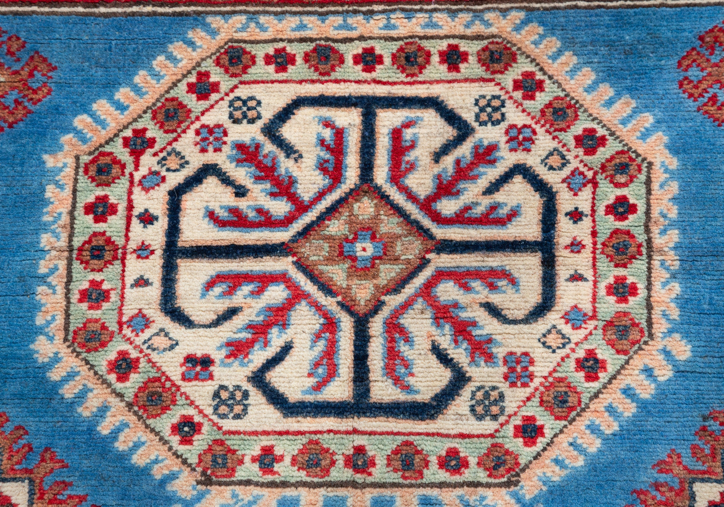 Pattern detail of blue & red Kazak-inspired wool rug 29648.
