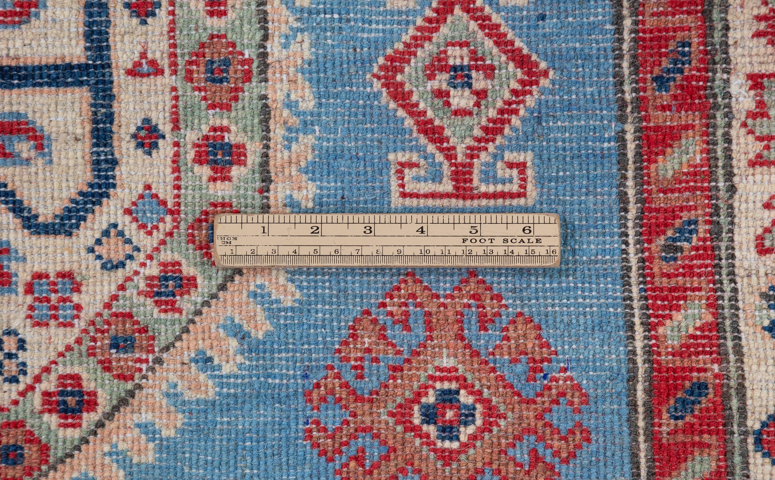 Wool pile close-up of blue & red Kazak-inspired wool rug 29648.