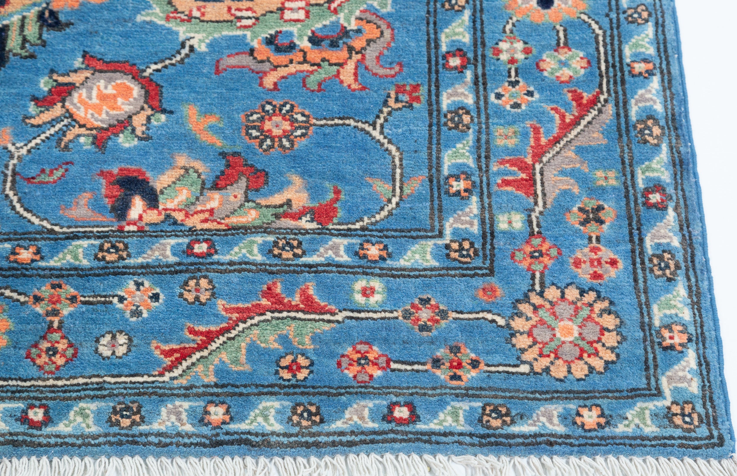 Border and edge detail of blue & red Kazak-inspired wool rug 29649.