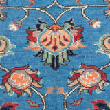 Pattern detail of blue & red Kazak-inspired wool rug 29649.