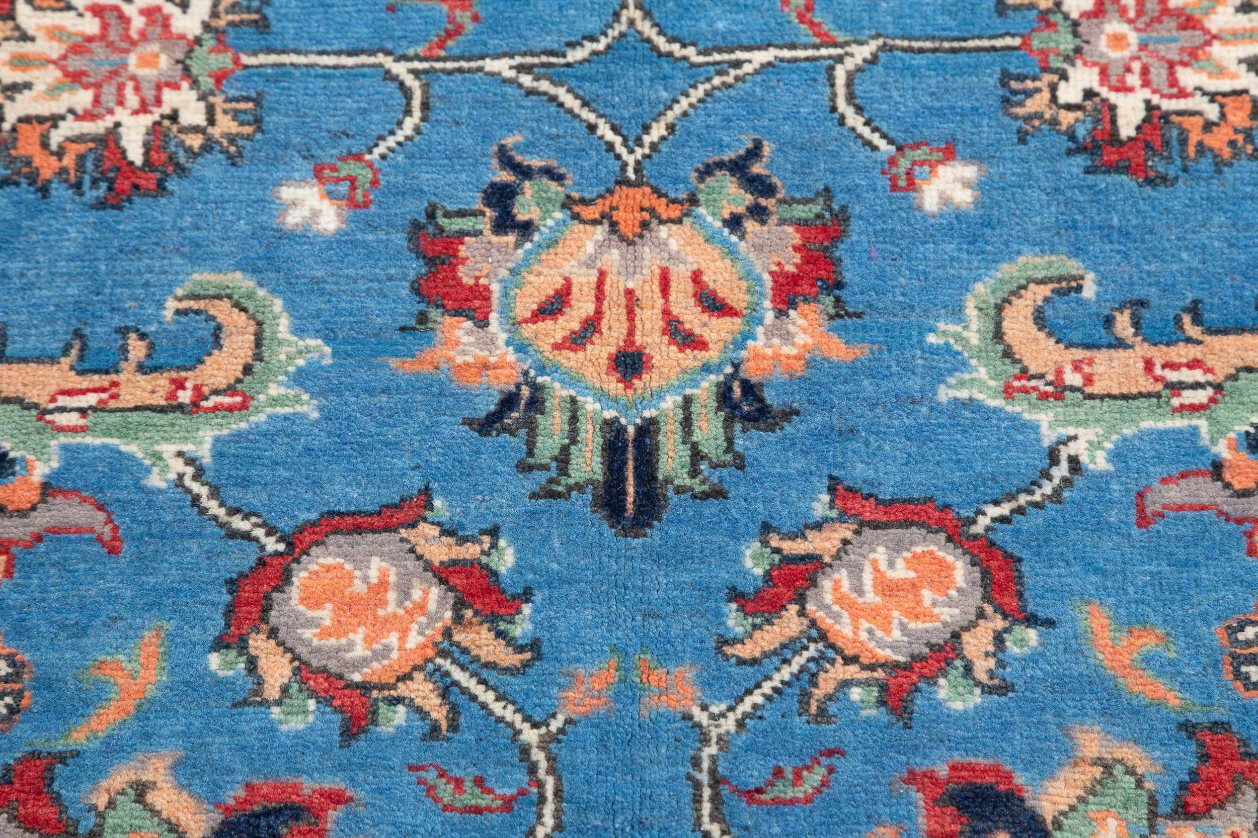 Pattern detail of blue & red Kazak-inspired wool rug 29649.