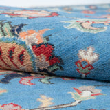 Folded edge and wool pile of blue & red Kazak-inspired wool rug 29649.