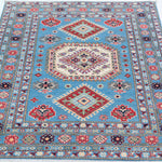 Full view from a low angle of blue & ivory Kazak-inspired wool rug 29650.