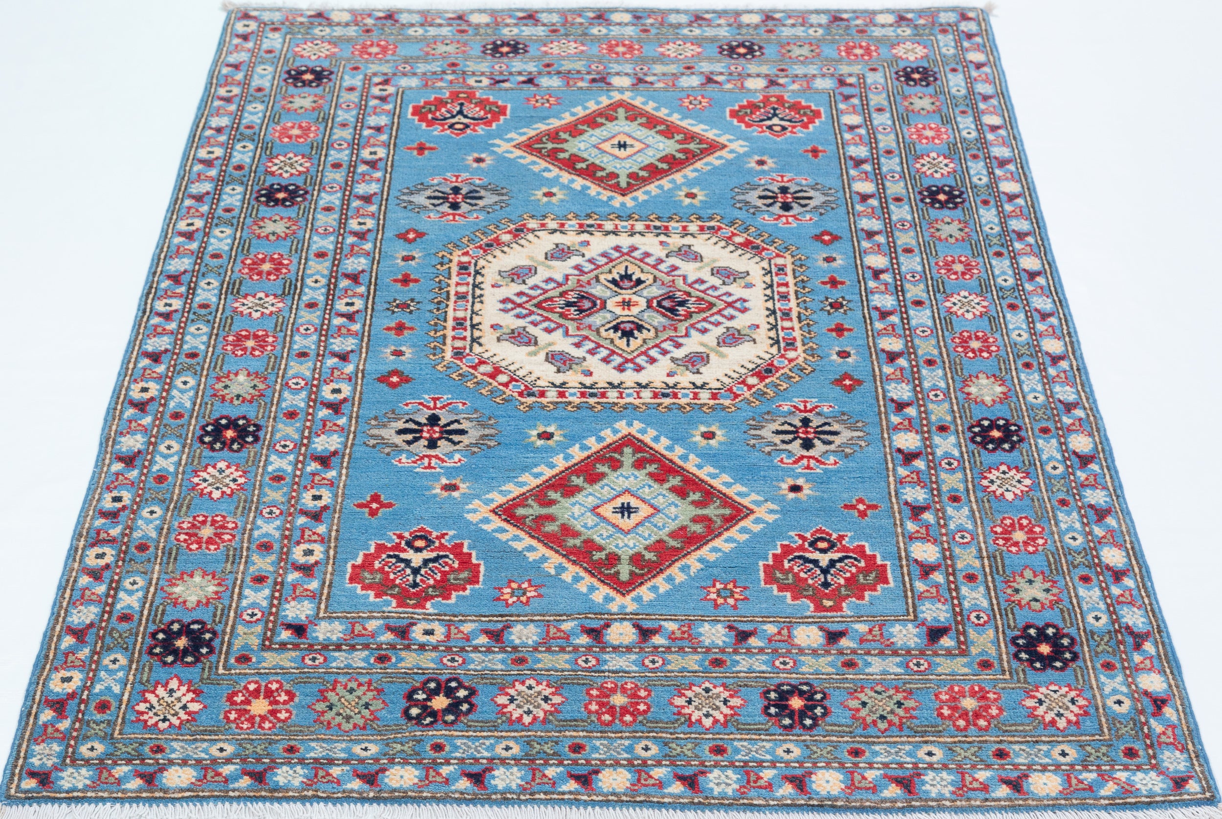 Full view from a low angle of blue & ivory Kazak-inspired wool rug 29650.