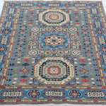 Full view from a low angle of blue & ivory Kazak-inspired wool rug 29651.