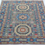Full view from a low angle of blue & ivory Kazak-inspired wool rug 29651.