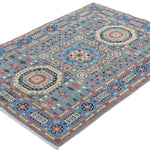 Full view at an angle of blue & ivory Kazak-inspired wool rug 29651.