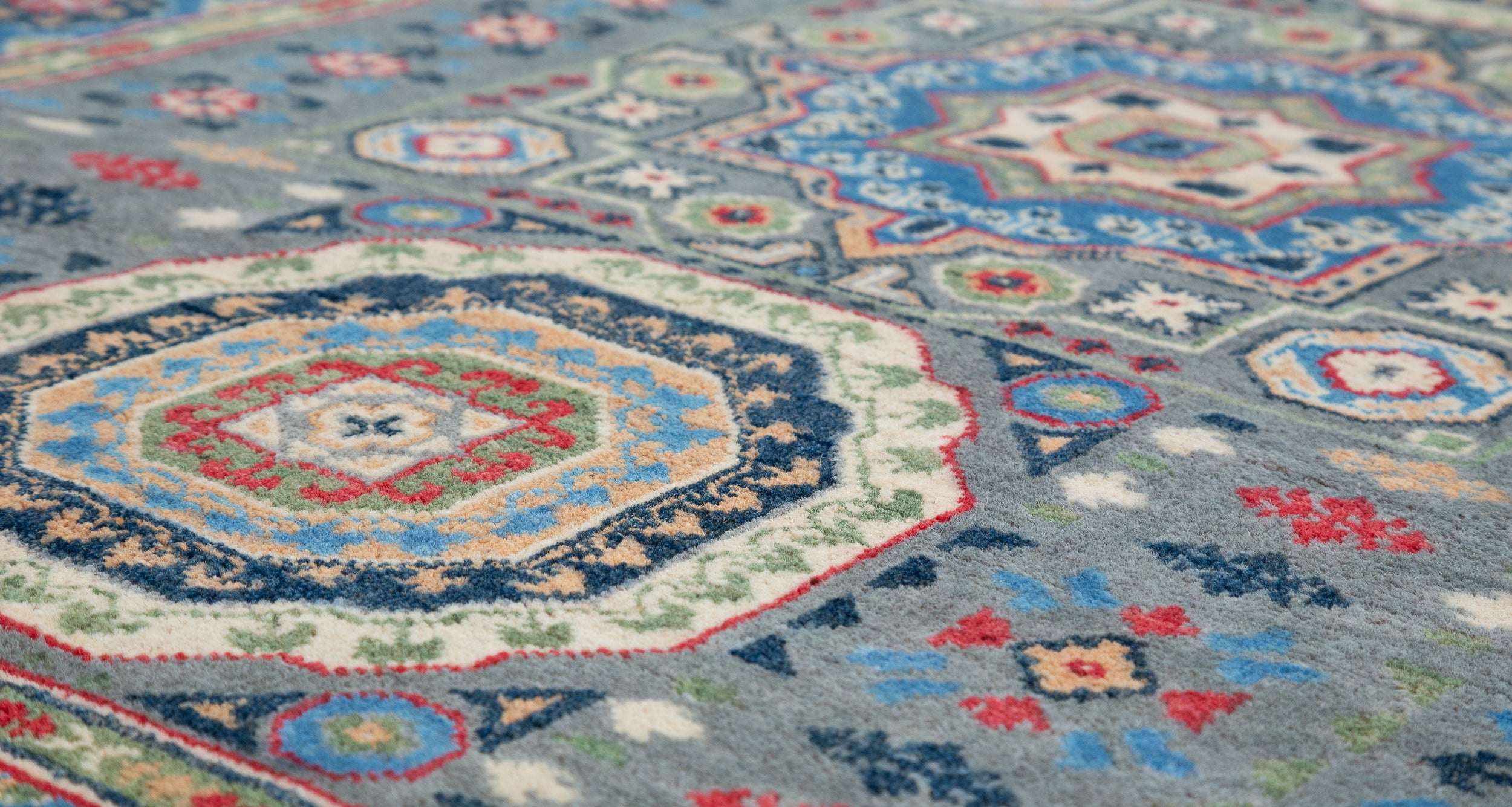 Pattern detail of blue & ivory Kazak-inspired wool rug 29651.