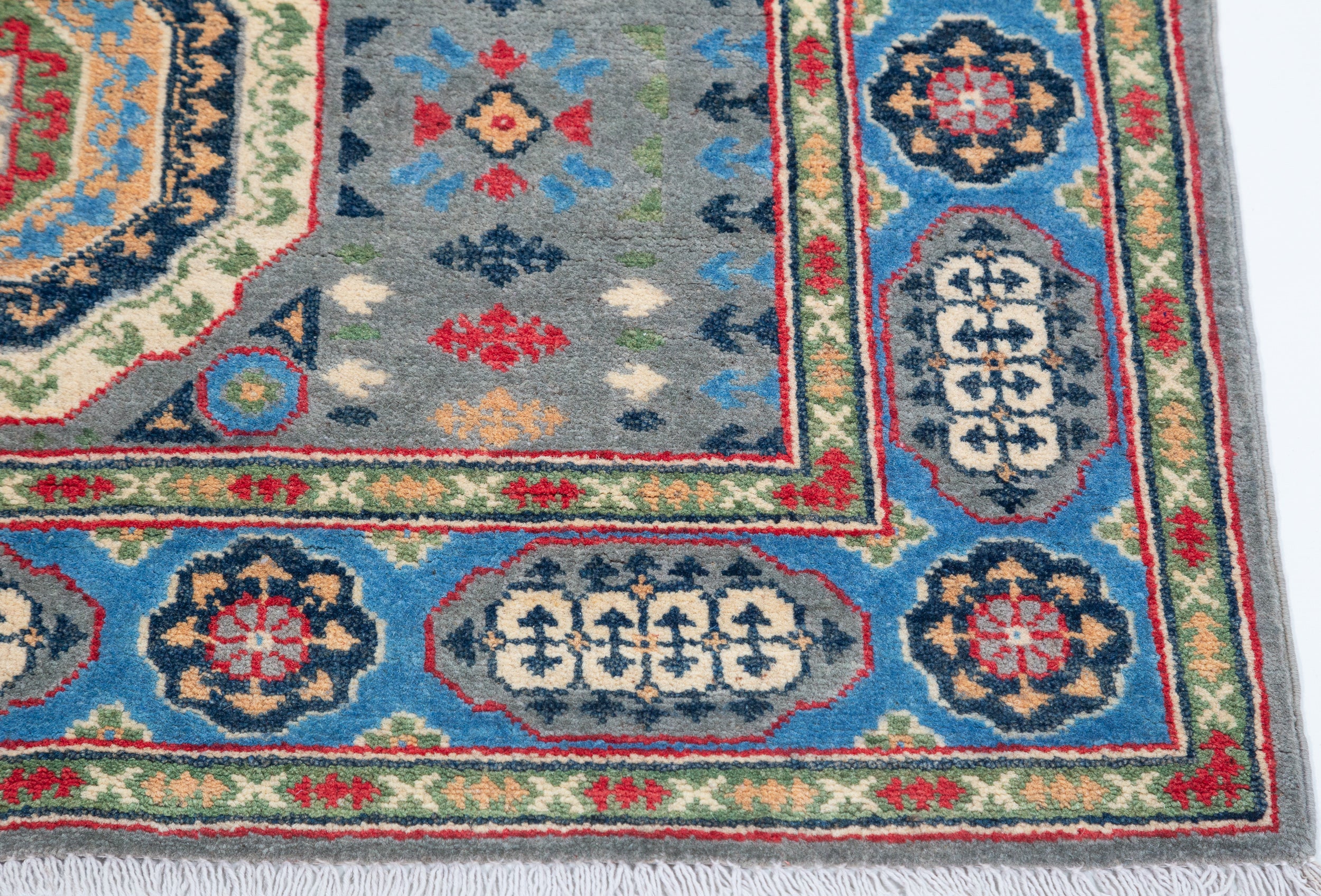 Border and edge detail of blue & ivory Kazak-inspired wool rug 29651.