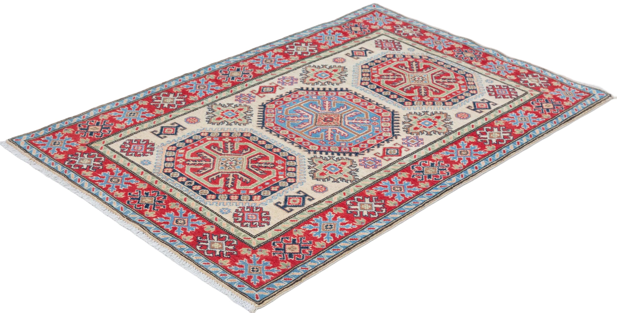 Full view at an angle of ivory & red Kazak-inspired wool rug 29652.