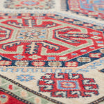Pattern detail of ivory & red Kazak-inspired wool rug 29652.