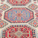 Pattern detail of ivory & red Kazak-inspired wool rug 29652.