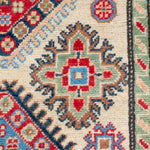Pattern detail of ivory & red Kazak-inspired wool rug 29652.
