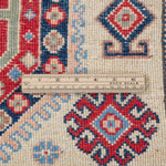 Wool pile close-up of ivory & red Kazak-inspired wool rug 29652.