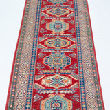 Full view from a low angle of red & blue Kazak-inspired wool runner 29654.