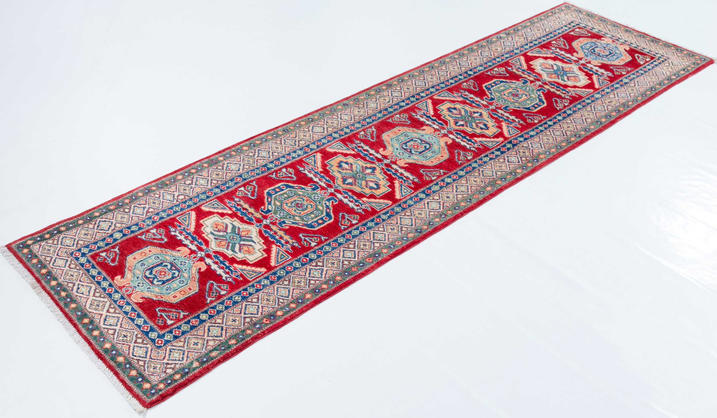 Full view at an angle of red & blue Kazak-inspired wool runner 29654.