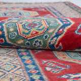 Folded edge and wool pile of red & blue Kazak-inspired wool runner 29654.