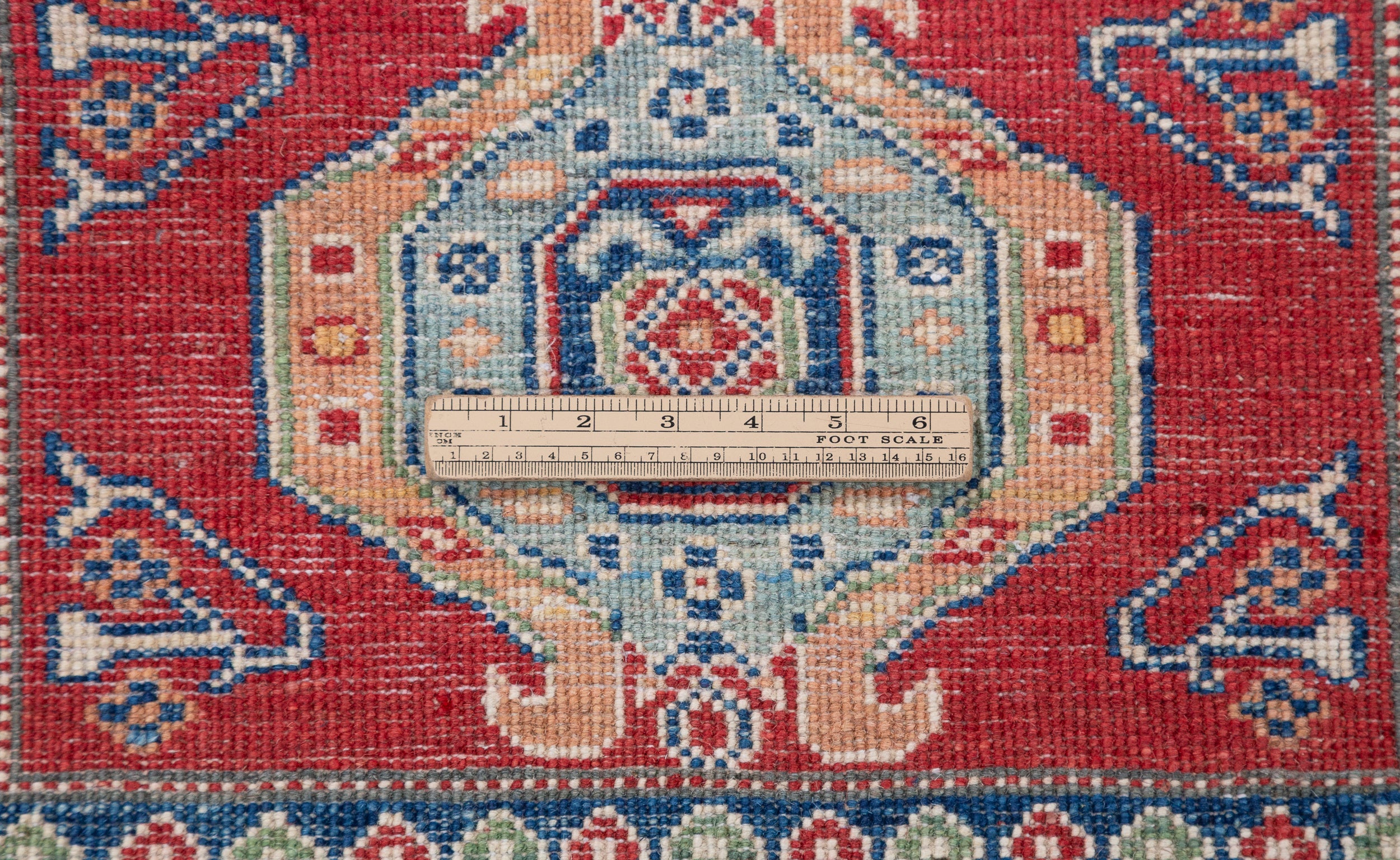 Wool pile close-up of red & blue Kazak-inspired wool runner 29654.