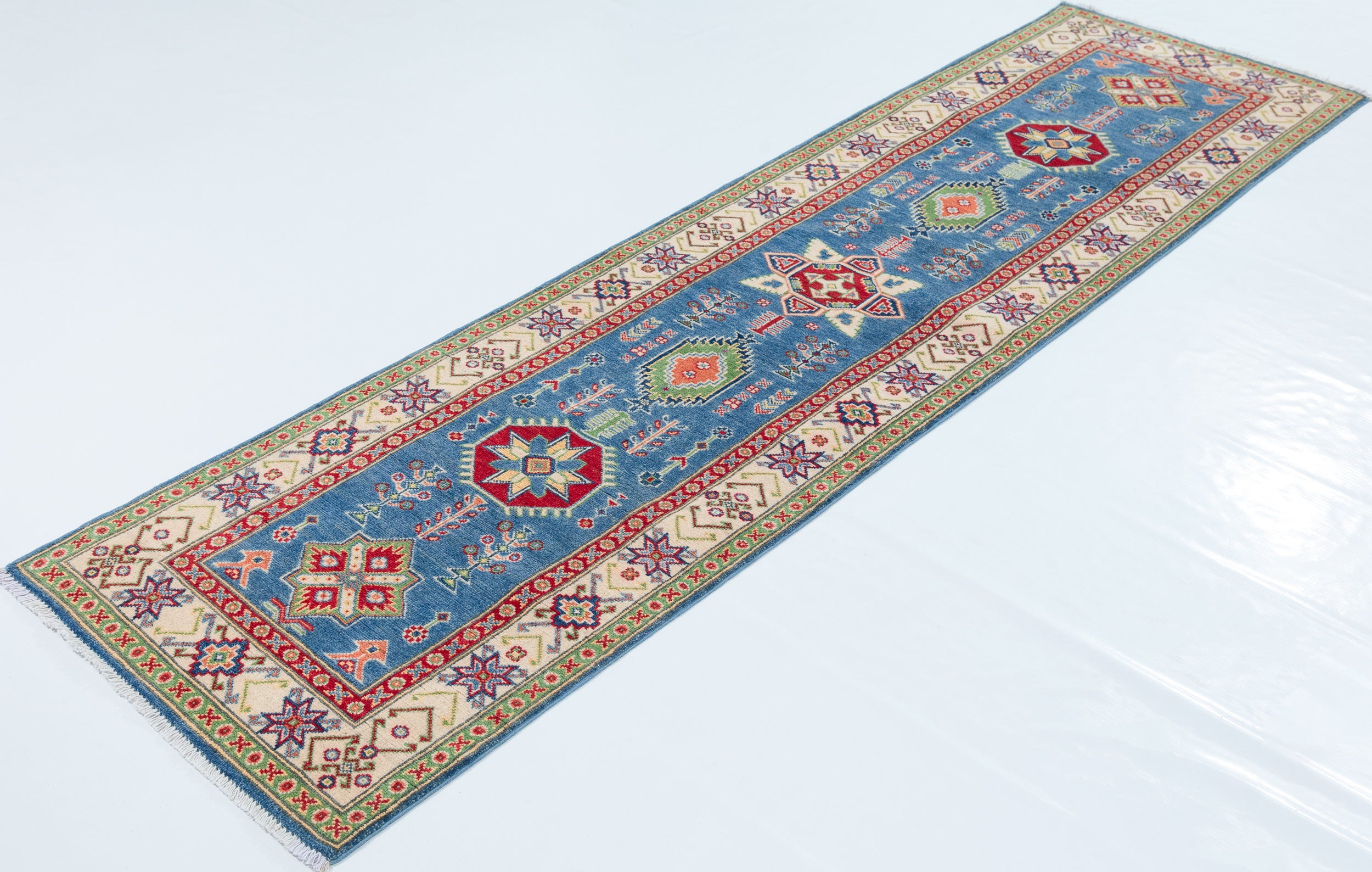 Full view at an angle of blue & ivory Kazak-inspired wool runner 29655.