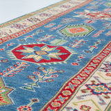 Pattern detail of blue & ivory Kazak-inspired wool runner 29655.