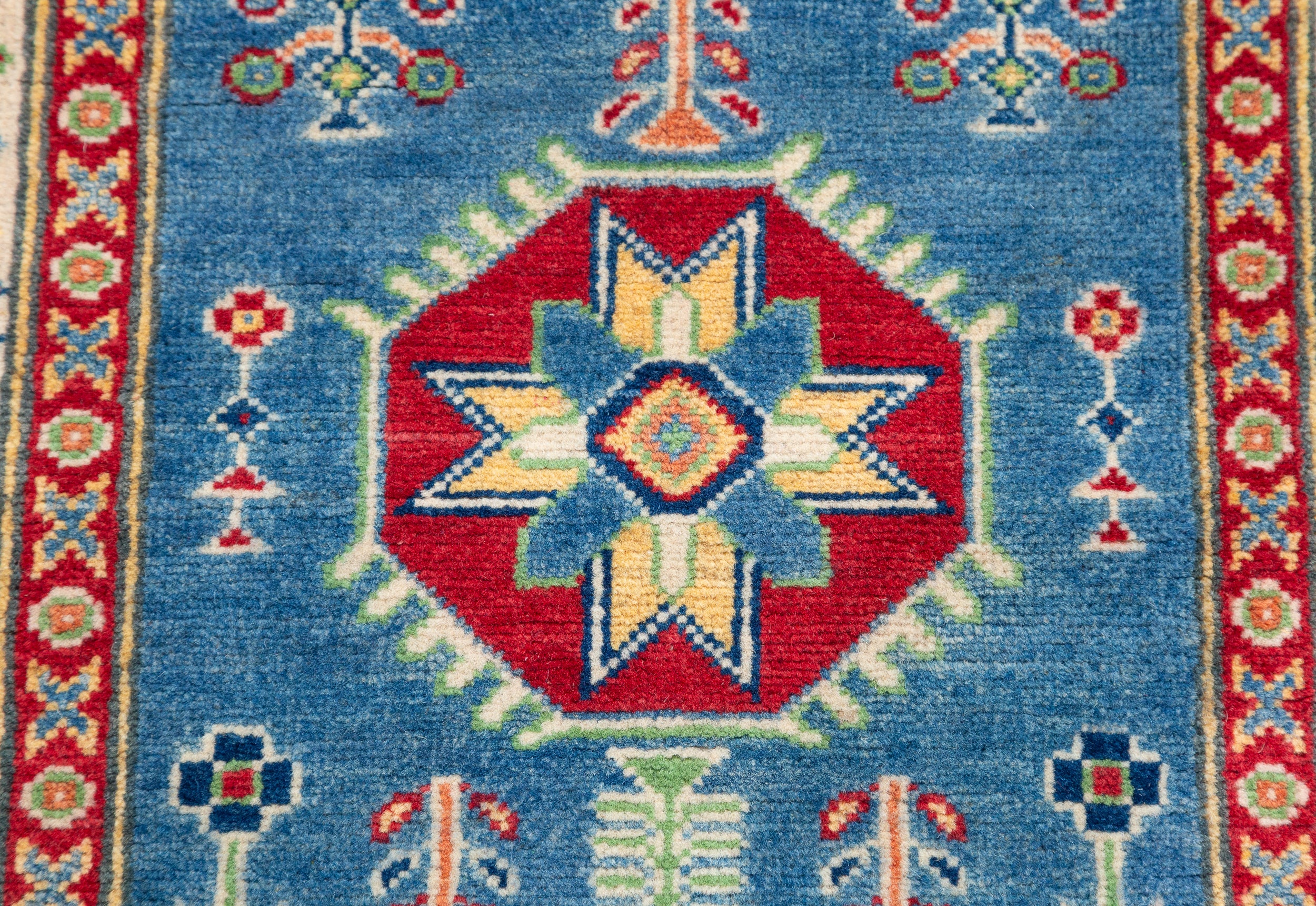 Pattern detail of blue & ivory Kazak-inspired wool runner 29655.