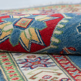 Folded edge and wool pile of blue & ivory Kazak-inspired wool runner 29655.
