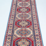Full view from a low angle of blue & red Kazak-inspired wool runner 29656.