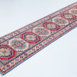 Full view at an angle of blue & red Kazak-inspired wool runner 29656.
