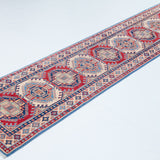 Full view at an angle of blue & red Kazak-inspired wool runner 29656.