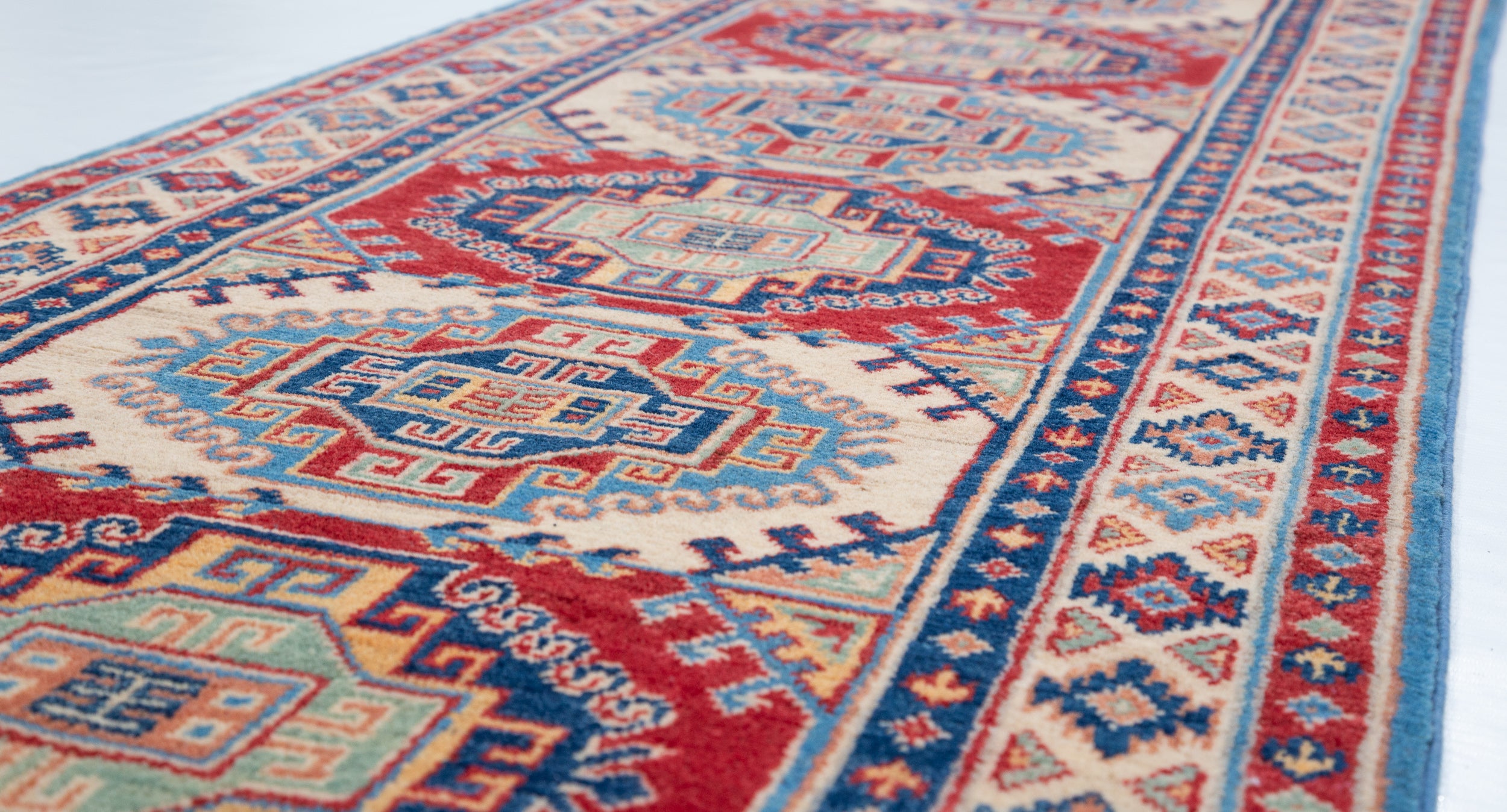 Pattern detail of blue & red Kazak-inspired wool runner 29656.