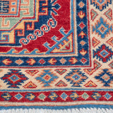 Border and edge detail of blue & red Kazak-inspired wool runner 29656.