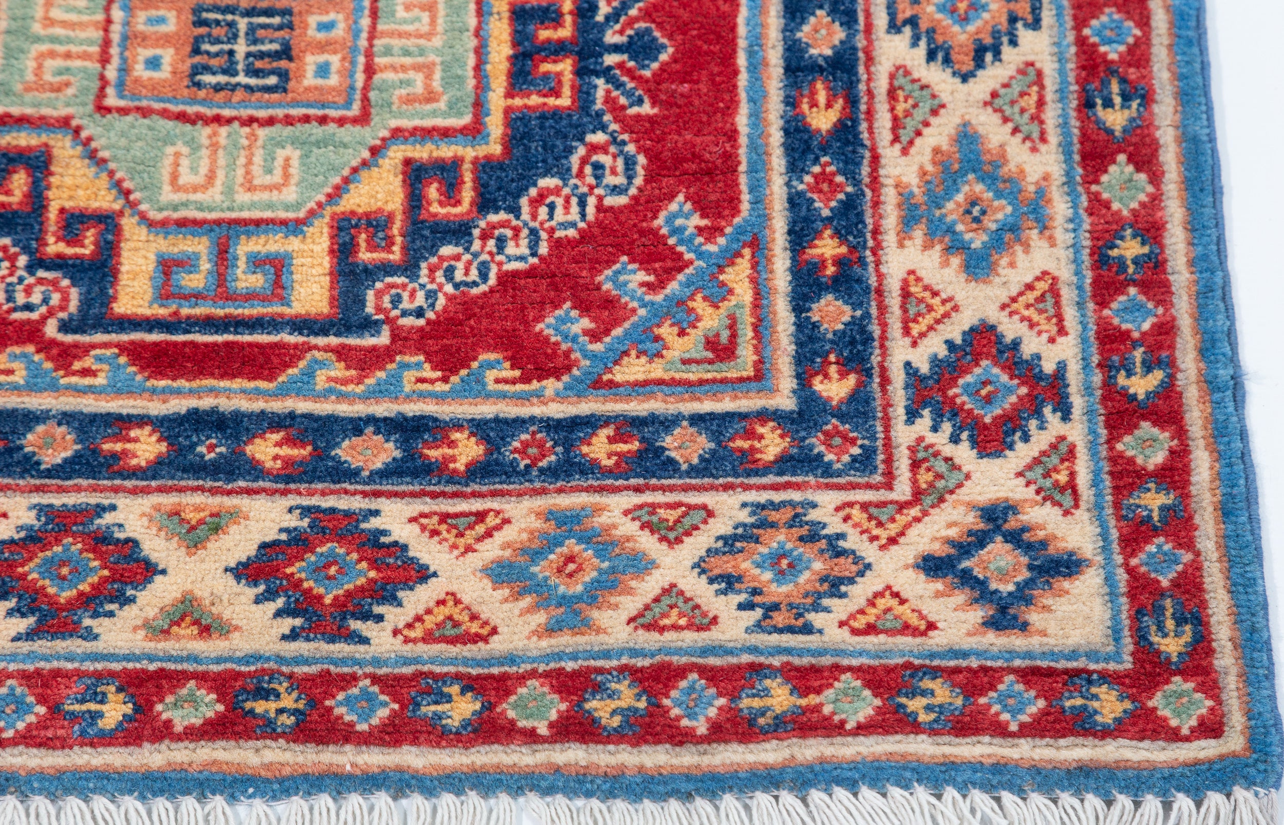 Border and edge detail of blue & red Kazak-inspired wool runner 29656.