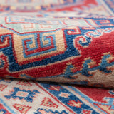 Folded edge and wool pile of blue & red Kazak-inspired wool runner 29656.
