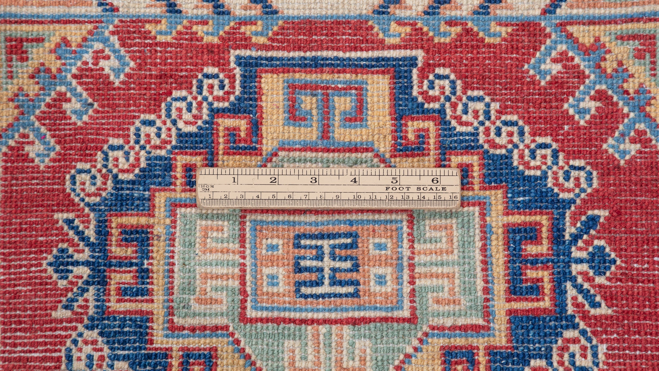 Wool pile close-up of blue & red Kazak-inspired wool runner 29656.